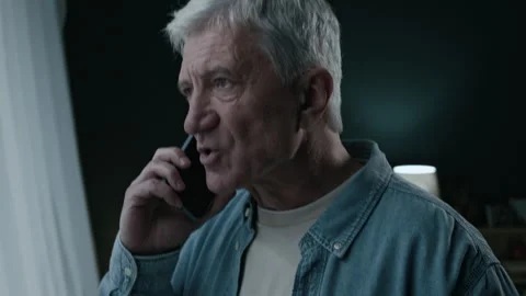Angry Elderly Man Yelling into Smartphone while Drinking Beer Stock Footage 300603915