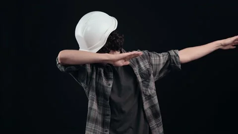 The angry engineer, with a white helmet, is ready to fight, he raises his fists Stock Footage 156277609