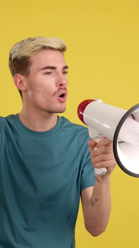 Angry gay man yelling using a loudspeaker 스톡 동영상 252485778