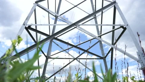 Angry grass against the background of the high-voltage transmission line Video stock 137263686