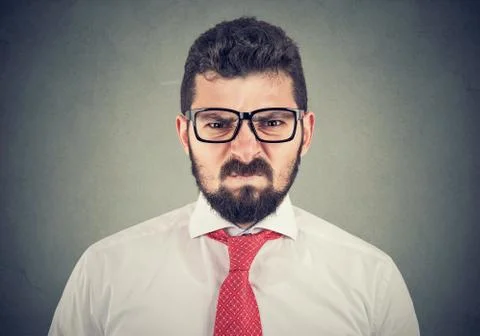 Angry grumpy man looking very displeased Stock Photos