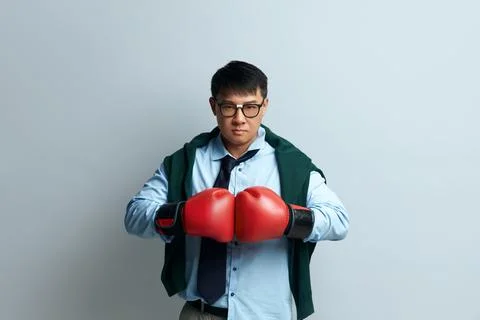 Angry Guy Boxing Studio. Portrait of Asian Man Standing with Boxing Fists Stock Photos