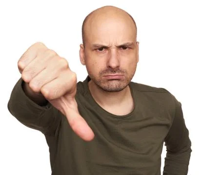 Angry guy with thumbs down. Isolated Stock Photos