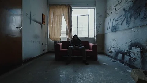 Angry hooded young man inside dark derelict ghetto building apartment,slowmo Vídeos de archivo 72563659