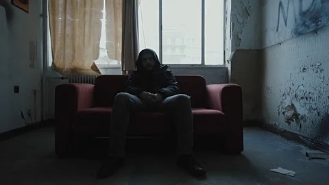 Angry hooded young man inside dark derelict ghetto building apartment,slowmo Vídeos de archivo 72564057