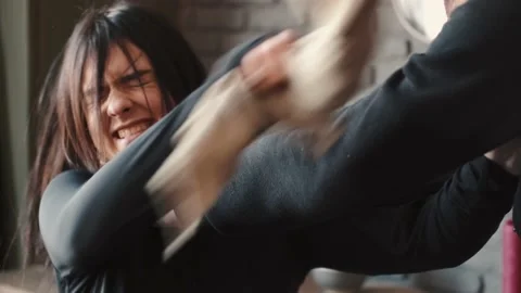 Angry husband beating and choking scared wife at home Stock Footage 150241348