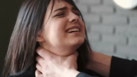 Angry husband beating and choking scared wife at home Stock Footage 150241349