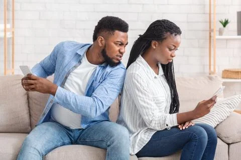 Angry Husband Catching Cheating Wife Texting On Cellphone With Another Man Stock Photos
