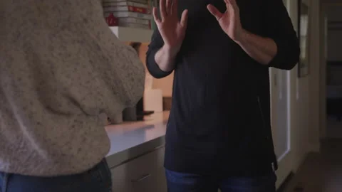 Angry Husband Gestures with His Hands as He Argues with His Wife Stock Footage 208719271