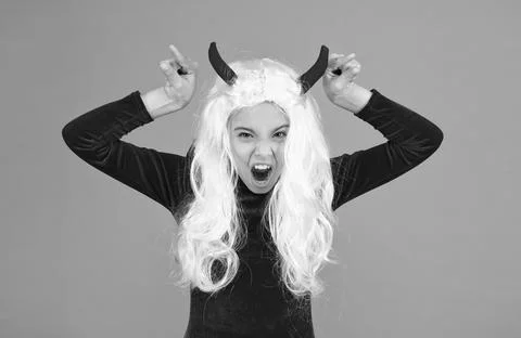 Angry imp with red horns. devil costume. happy halloween. creepy child in devil Foto stock