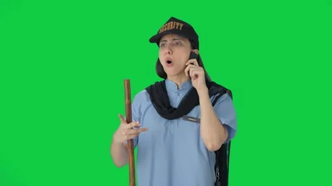 Angry Indian female security guard fighting with someone on call Green screen Stock Footage 250265053