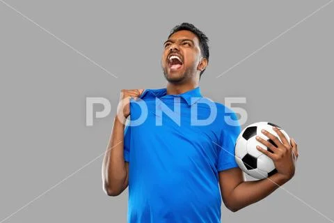 Angry indian male football fan with soccer ball Stock Photos