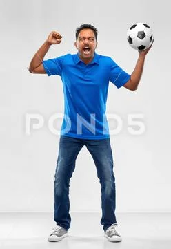 Angry indian male football fan with soccer ball Stock Photos