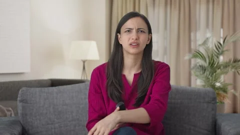 Angry Indian woman watching TV | Stock Video | Pond5