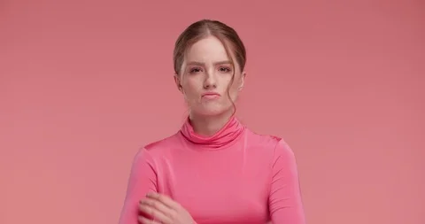 Angry Indignant Girl is posing on Studio to the Camera, showing her Whims.  Stock Footage 126225573