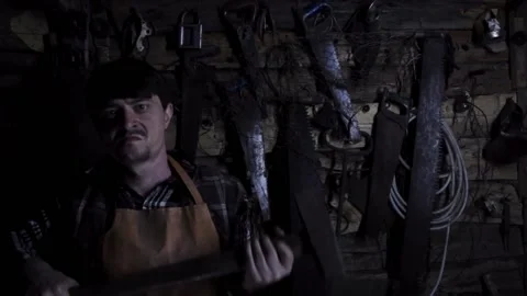 Angry insane maniac with a rusty sledgehammer in an old house Stock Footage 135655090