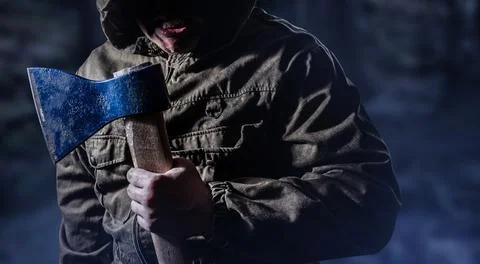 Angry killer with an axe. Stock Photos