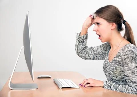 Angry lady yelling on computer screen Stock Photos