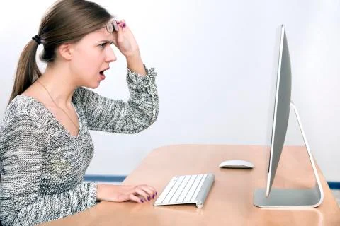 Angry lady yelling on computer screen Stock Photos