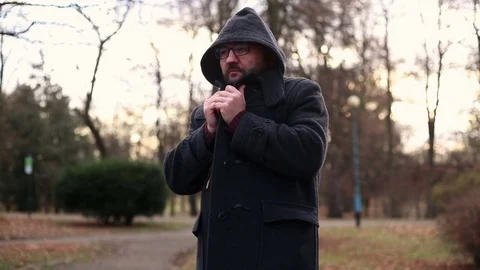 Angry male man talking on camera in the autumnal park  Stock Footage 71023457