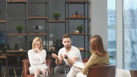 Angry man arguing and talking about his wife to marriage counselor. Stock Footage 125489868
