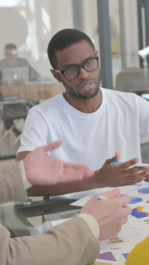 Angry Man in Argument with Colleagues while Doing Paperwork, vertical video Video stock 324694544