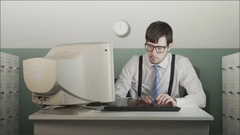 Angry man is beating old computer with hand in office. Video stock 167292309