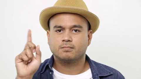 Angry Man in denim jacket closed his mouth with imaginary zipper and throwing th Stock Footage 144652465