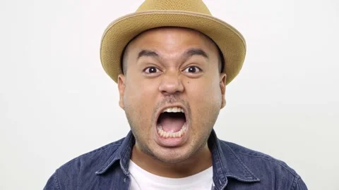 Angry Man in denim jacket closed his mouth with imaginary zipper and throwing th Video stock 144652480