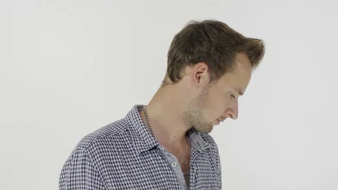 An angry man is gesticulating on a white background. 스톡 동영상 80319001