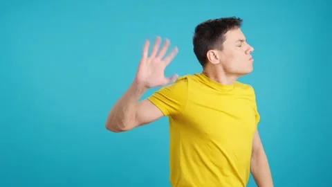 Angry man gesturing stop raising the hand 스톡 동영상 246227277