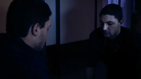 Angry man looks in the mirror. He is really furious Video stock 34272127