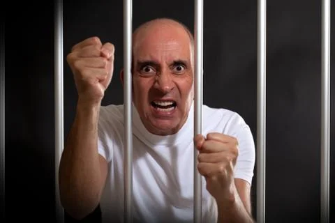 Angry man in prison Stock Photos