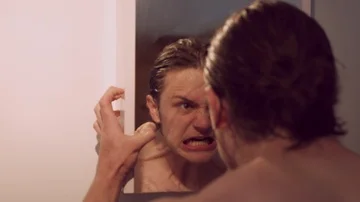 Angry man screaming at himself in the steamy mirror, bathroom  Stock Footage 85659096