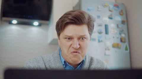 Angry man screams sitting at the computer Stock Footage 148350226