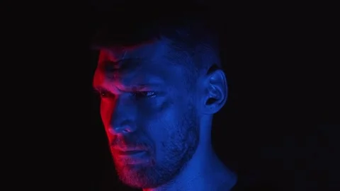 Angry man seems to be staring at his enemy, rival, victim or pray Stock Footage 158587379