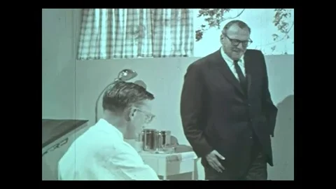 Angry man shout at doctor in clinic - 1965 Stock Footage