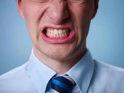 Angry man shouting at camera. close up Stock Photos
