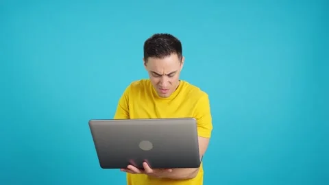 Angry man with some problems with the laptop Stock Footage 242947932