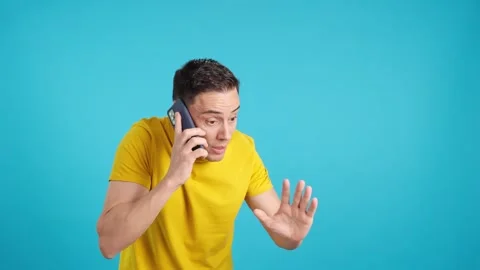 Angry man talking on the mobile phone Stock Footage 242945017
