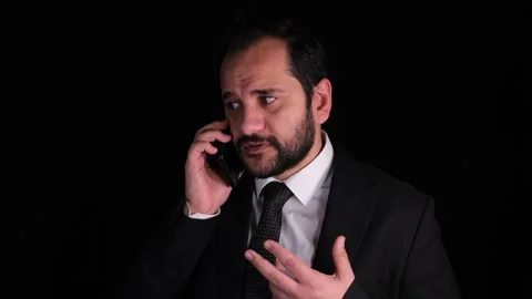 Angry man talking on phone Stock Footage 170346370