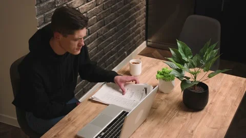 Angry man talking by video chatting on laptop at home office. Aggressive manager Stock Footage 148385171