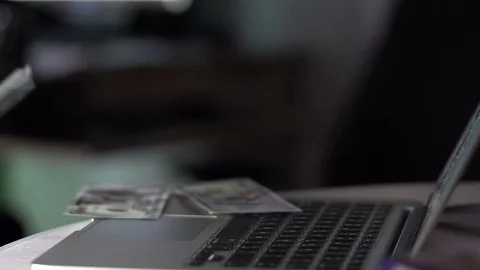 Angry man throwing dollars on laptop Stock-Footage 73457732