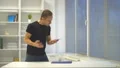 The angry man throws the phone on the table. slow motion 4k or 4k+ Resolution