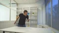 The angry man throws the smartphone on the table. slow motion 4k or 4k+ Resolution