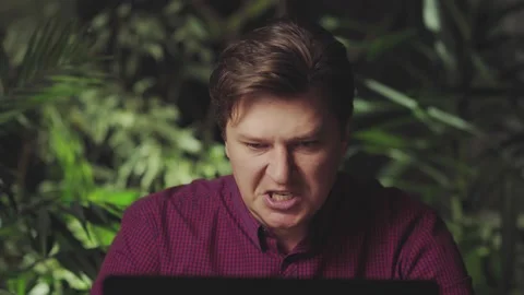 Angry man yells while working at the computer Stock Footage 150149168