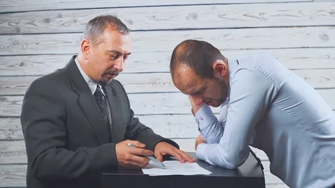 Angry mean caucasian boss shouting scolding frustrated incompetent employee for Stock Footage