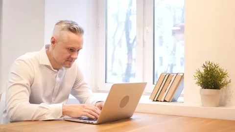 Angry Middle Age Man Working on Laptop Stock Footage 70940821