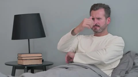 Angry Middle Aged Man Feeling Stressed while in Bed Video stock 287898804