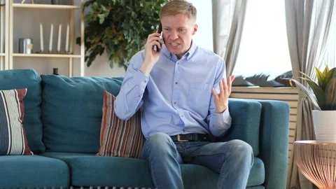 Angry Middle Aged Man Yelling while Talking on Phone Stock Footage 91643865